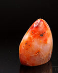 Carneol Heilstein, Heilstein für energetischen Mut, orange glatte Form.