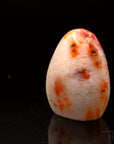 Carneol Heilstein, Heilstein für spirituellen Schutz, orange glatte Oberfläche.
