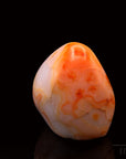 Natürlicher Carneol, fördert energetische Harmonie, orange Oberfläche.