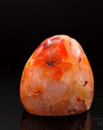 Carneol Heilstein, Heilstein für innere Stärke, orange glänzende Oberfläche.
