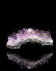 Natürlicher Amethyst Kristall, fördert meditative Harmonie, ungeschliffene violette Struktur.