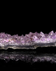 Amethyst Kristall für Balance, fördert meditative Praxis, violette Kristallstruktur.