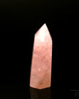 Rosenquarz Heilstein, fördert spirituelle Ruhe, rosa Kristalloberfläche.