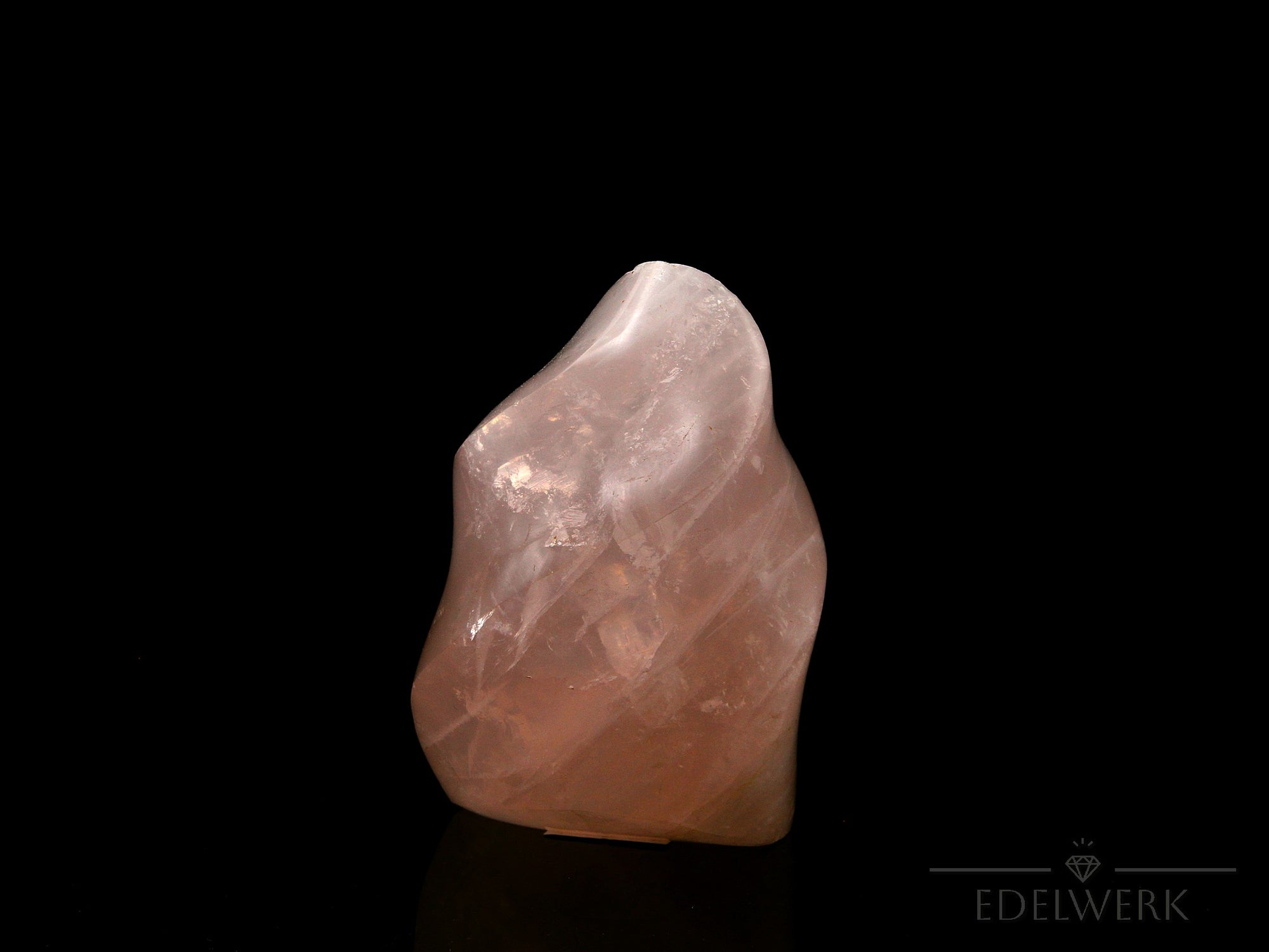 Rosenquarz Heilstein, Heilstein für energetische Klarheit, rosa glänzende Form.