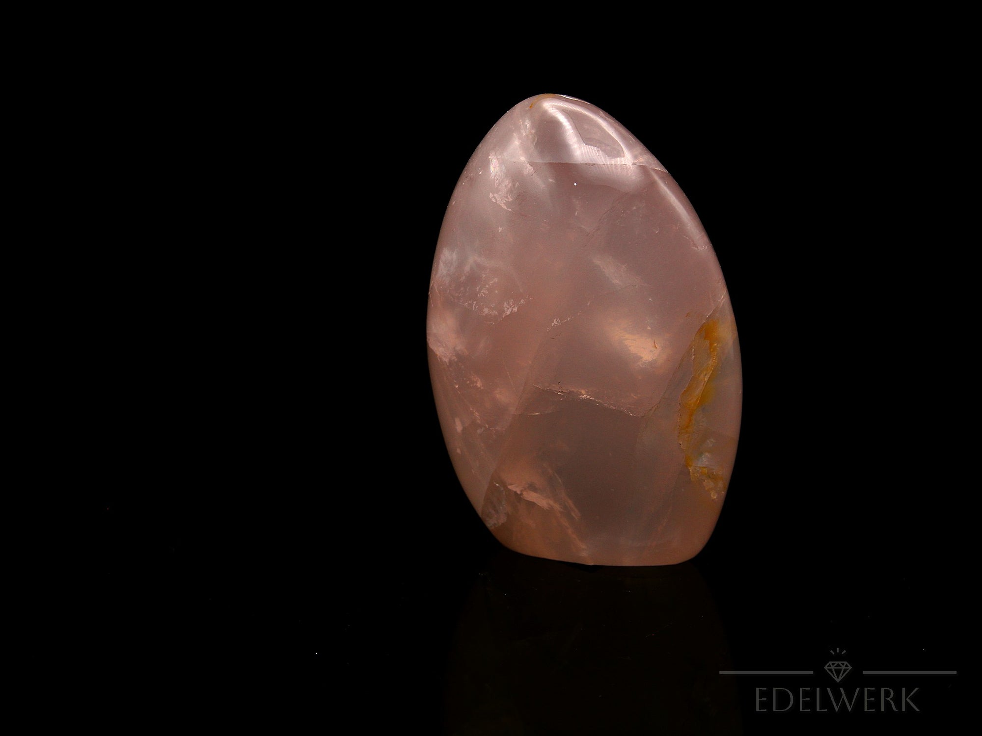 Strahlender Rosenquarz, Heilstein für innere Liebe, rosa Oberfläche.