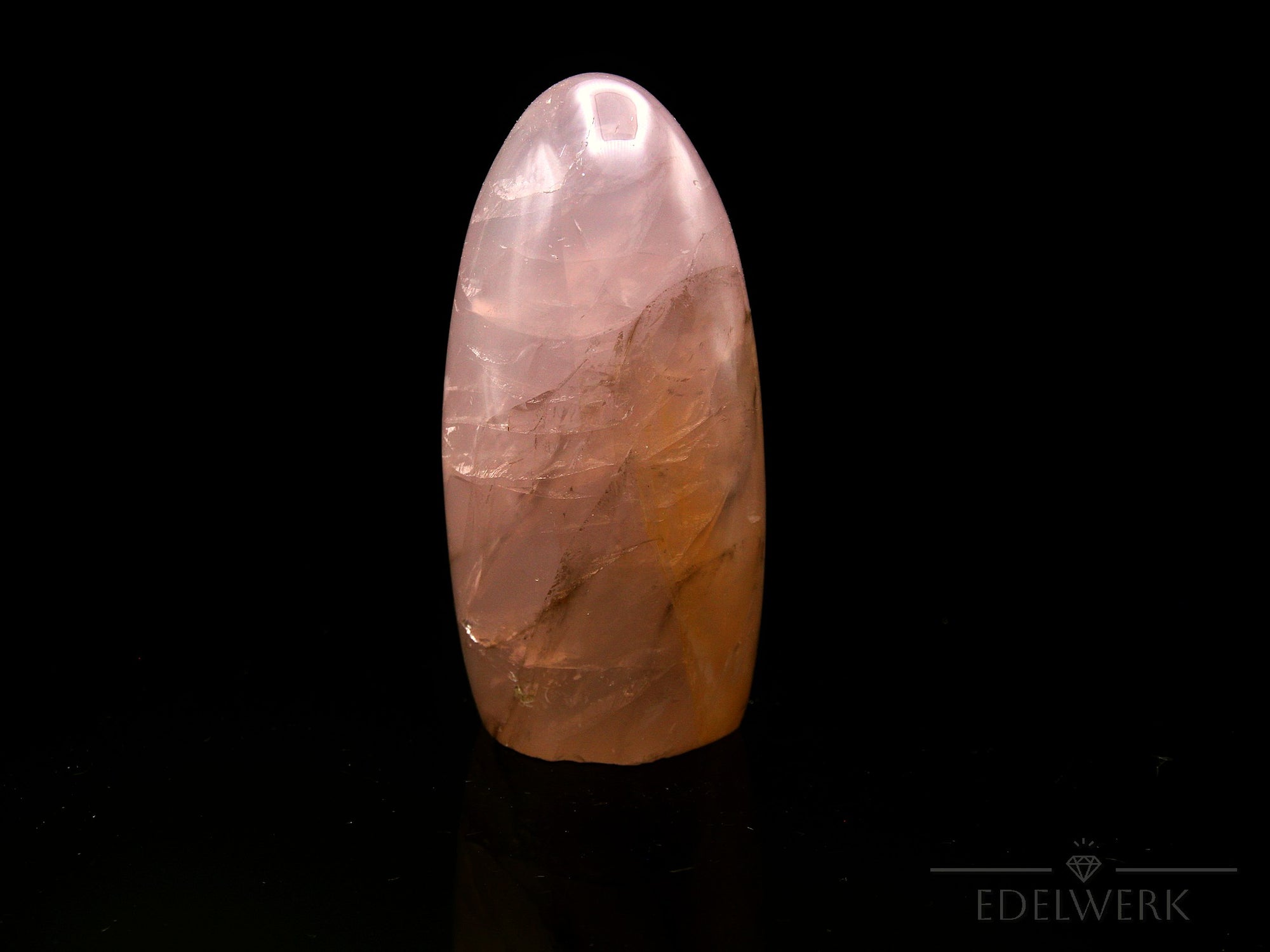 Klarer Rosenquarz, Heilstein für meditative Ruhe, rosa Kristalloberfläche.
