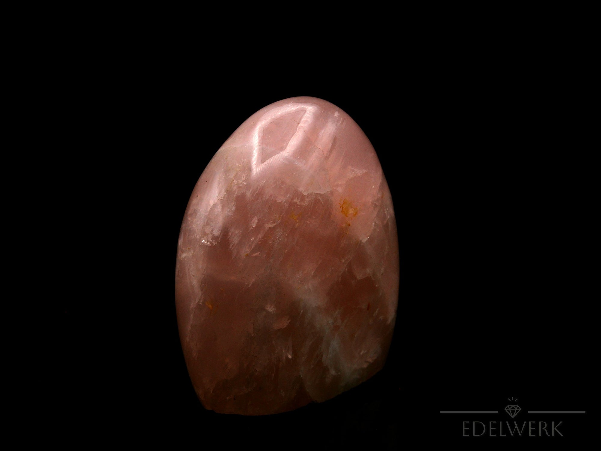 Strahlender Rosenquarz, Heilstein für klare Energie, rosa glänzende Form.