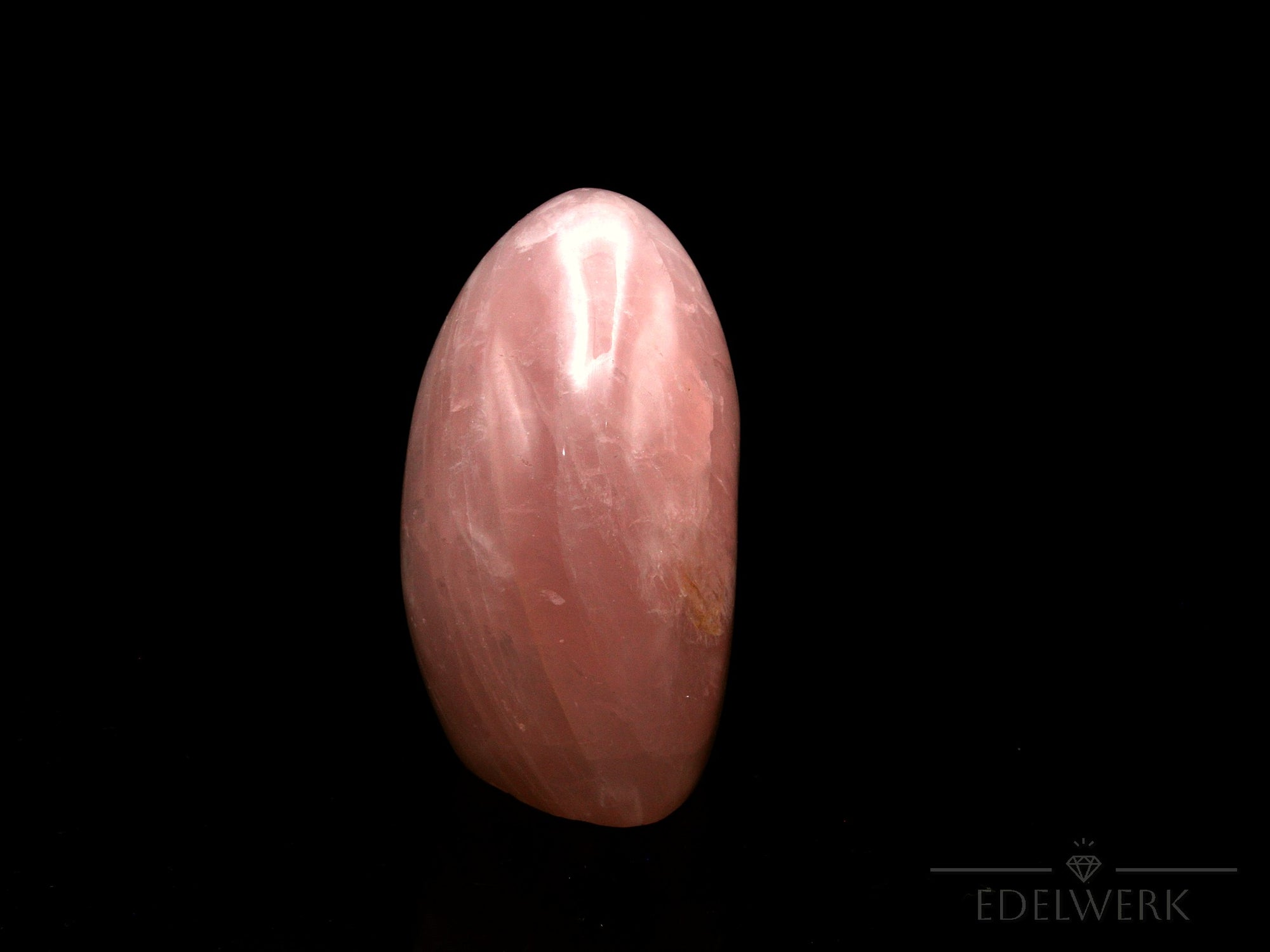 Klarer Rosenquarz, Heilstein für meditative Ruhe, rosa Kristalloberfläche.