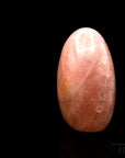 Rosenquarz Heilstein, fördert spirituelle Balance, rosa Kristalloberfläche.