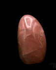 Strahlender Rosenquarz, fördert spirituelle Ruhe, rosa Kristalloberfläche.