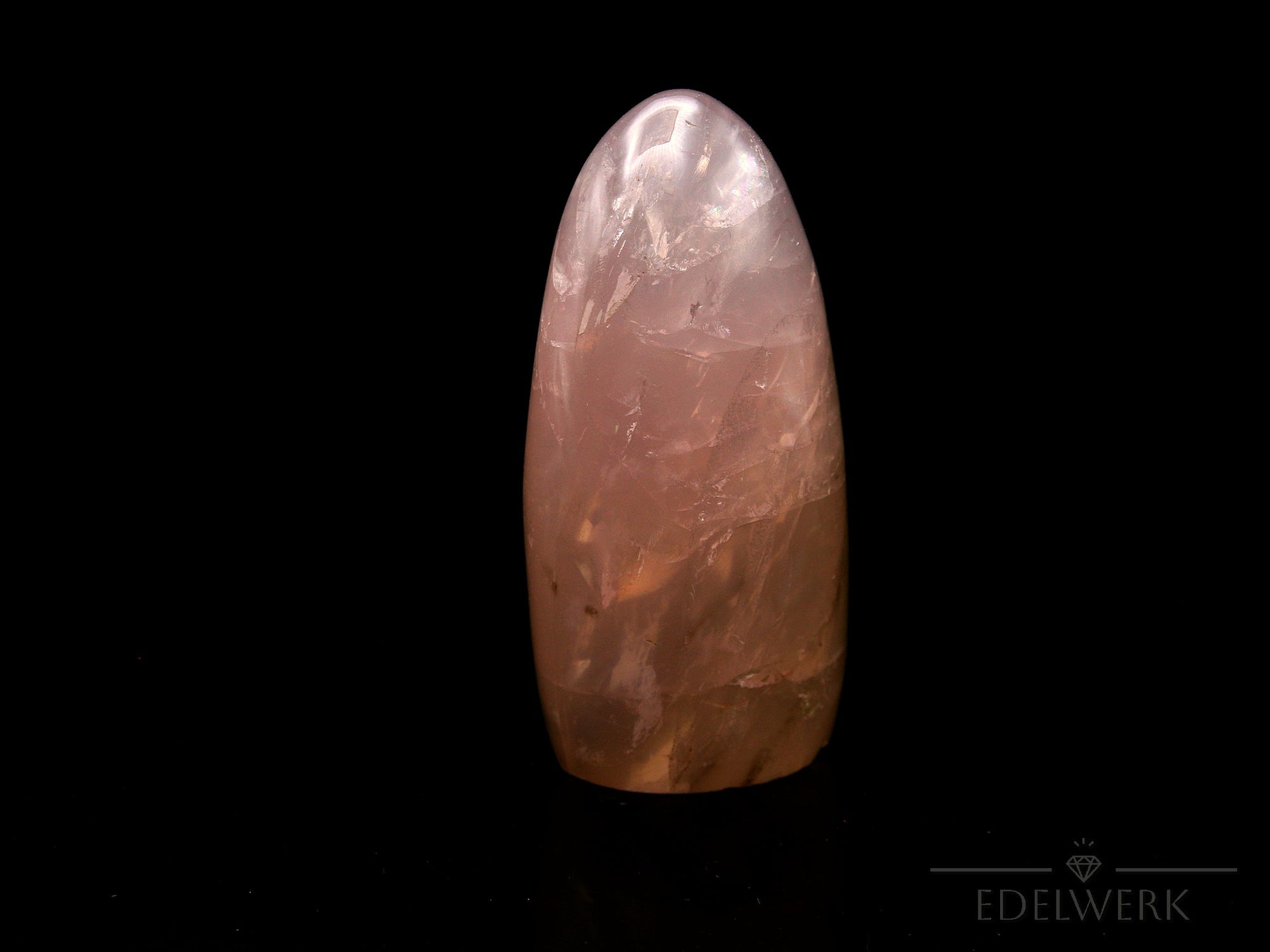 Klarer Rosenquarz, Heilstein für klare Energie, rosa Kristallform.