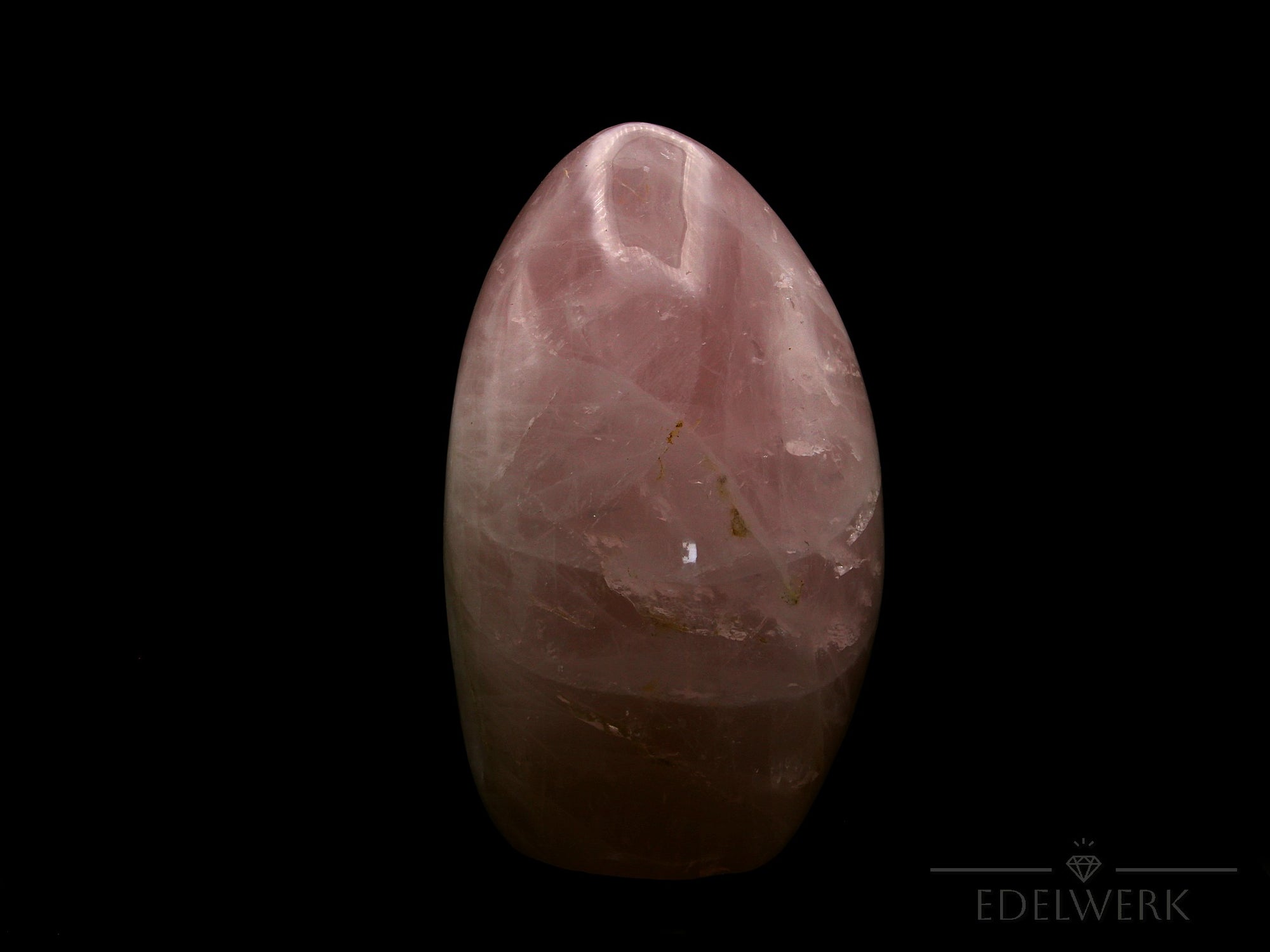 Rosenquarz Heilstein, Heilstein für spirituelle Liebe, rosa glänzende Form.