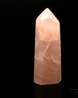 Strahlender Rosenquarz, fördert spirituelle Klarheit, rosa Kristalloberfläche.