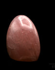 Klarer Rosenquarz, fördert meditative Balance, durchsichtige rosa Oberfläche.