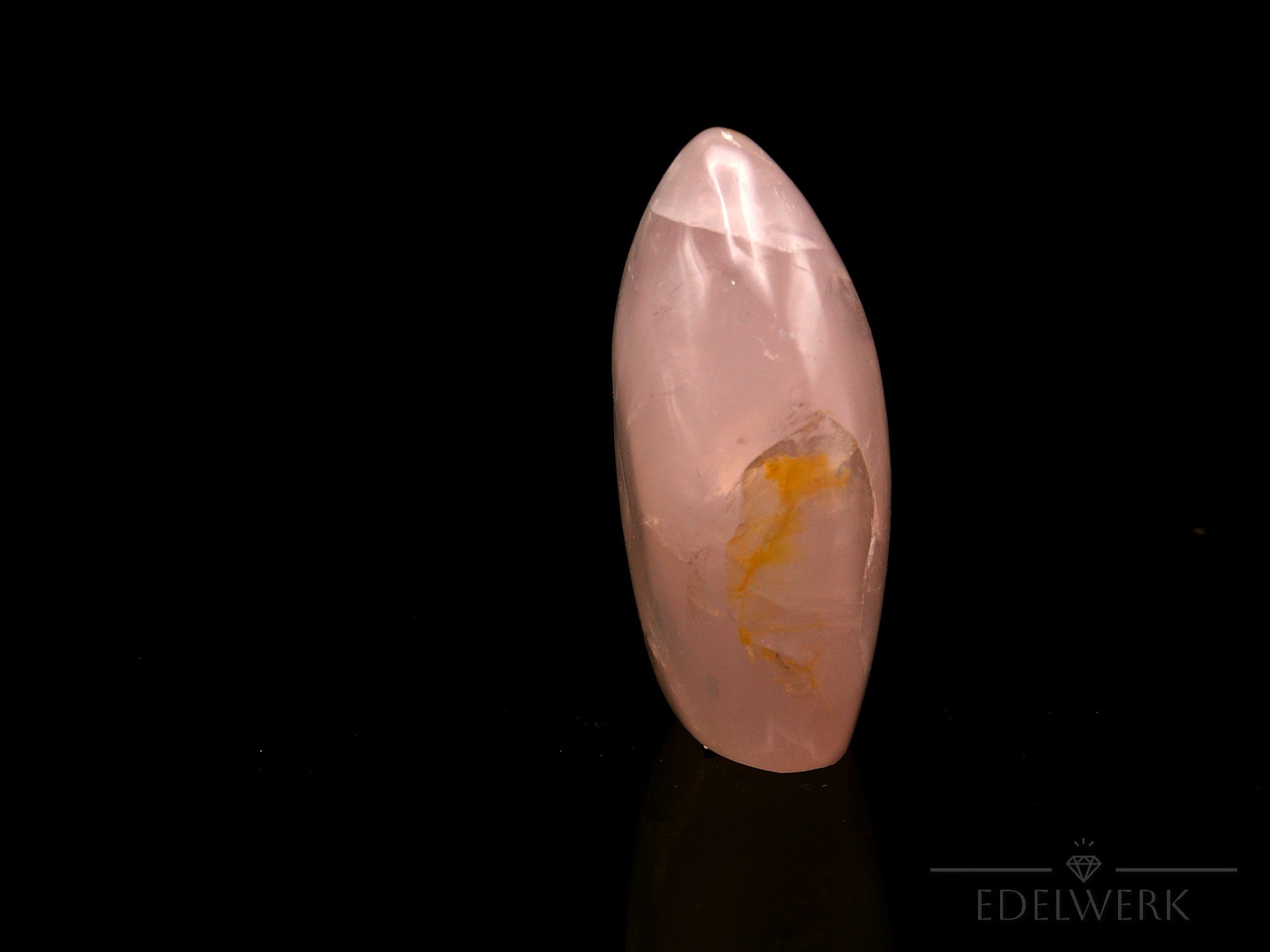 Klarer Rosenquarz, fördert meditative Harmonie, durchsichtige rosa Oberfläche.