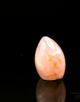 Klarer Rosenquarz, fördert energetische Energie, durchsichtige rosa Oberfläche.