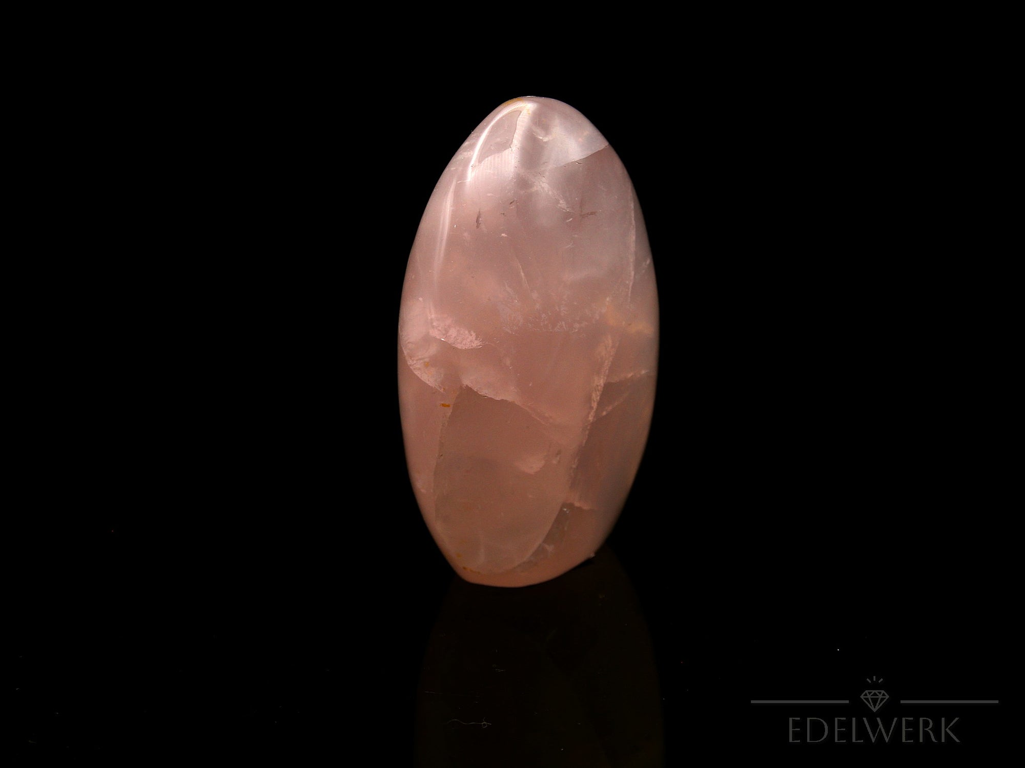 Strahlender Rosenquarz, Heilstein für klare Harmonie, rosa glänzende Form.
