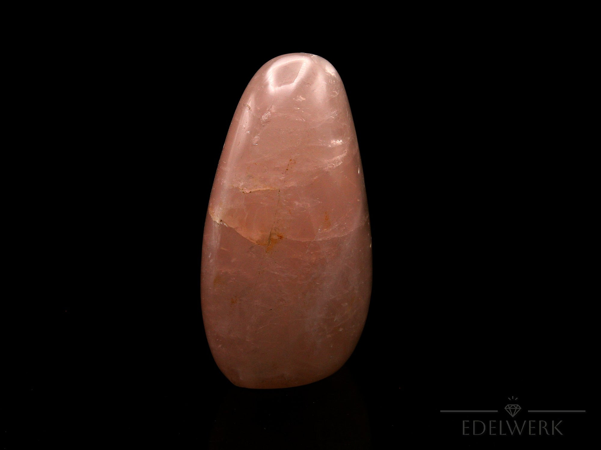 Natürlicher Rosenquarz, fördert spirituelle Entspannung, rosa Oberfläche.