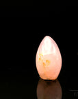 Klarer Rosenquarz, fördert spirituelle Balance, rosa glänzende Kristalle.
