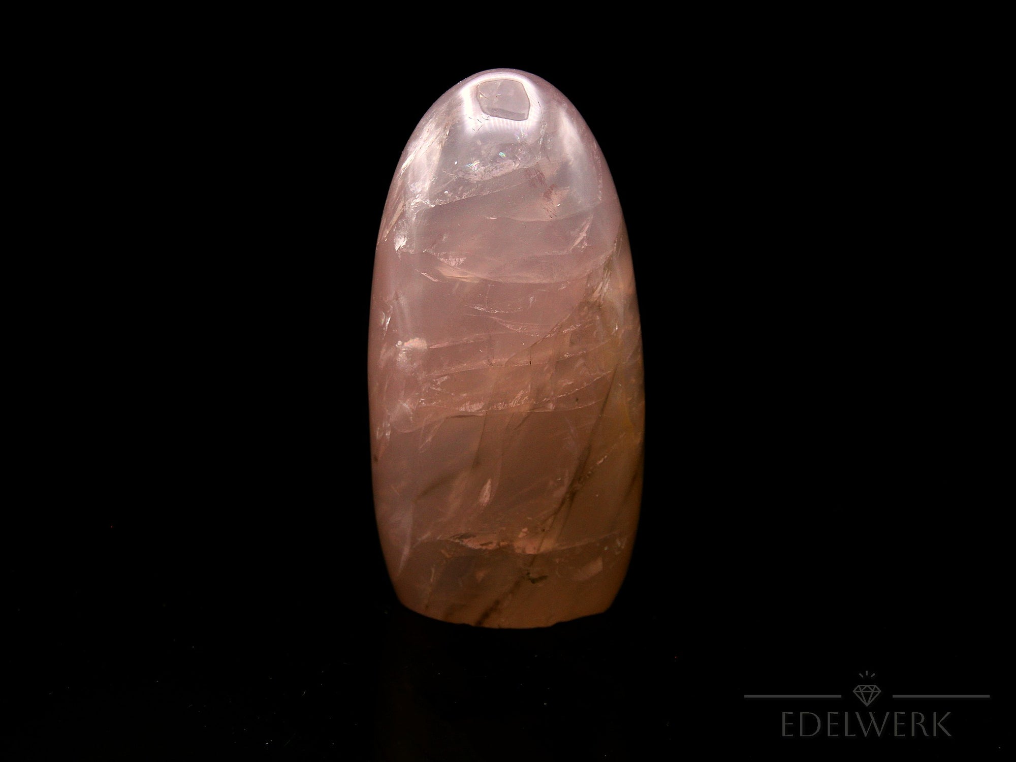 Klarer Rosenquarz, Heilstein für intuitive Harmonie, durchsichtige rosa Struktur.