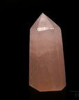 Klarer Rosenquarz, fördert spirituelle Balance, durchsichtige rosa Oberfläche.