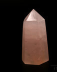Klarer Rosenquarz, fördert intuitive Harmonie, rosa glänzende Kristalle.