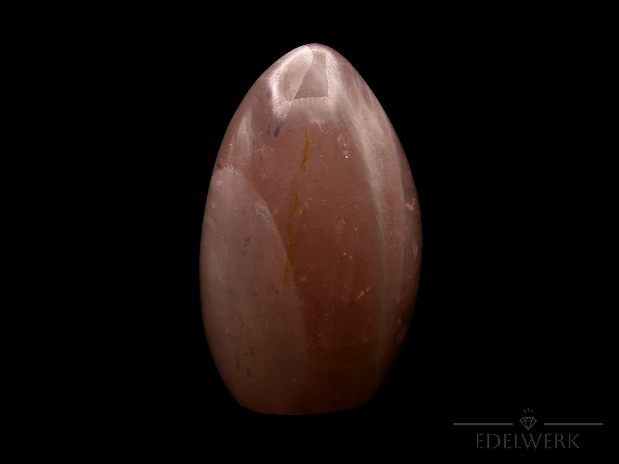 Natürlicher Rosenquarz, fördert klare Intuition, rosa glänzende Struktur.