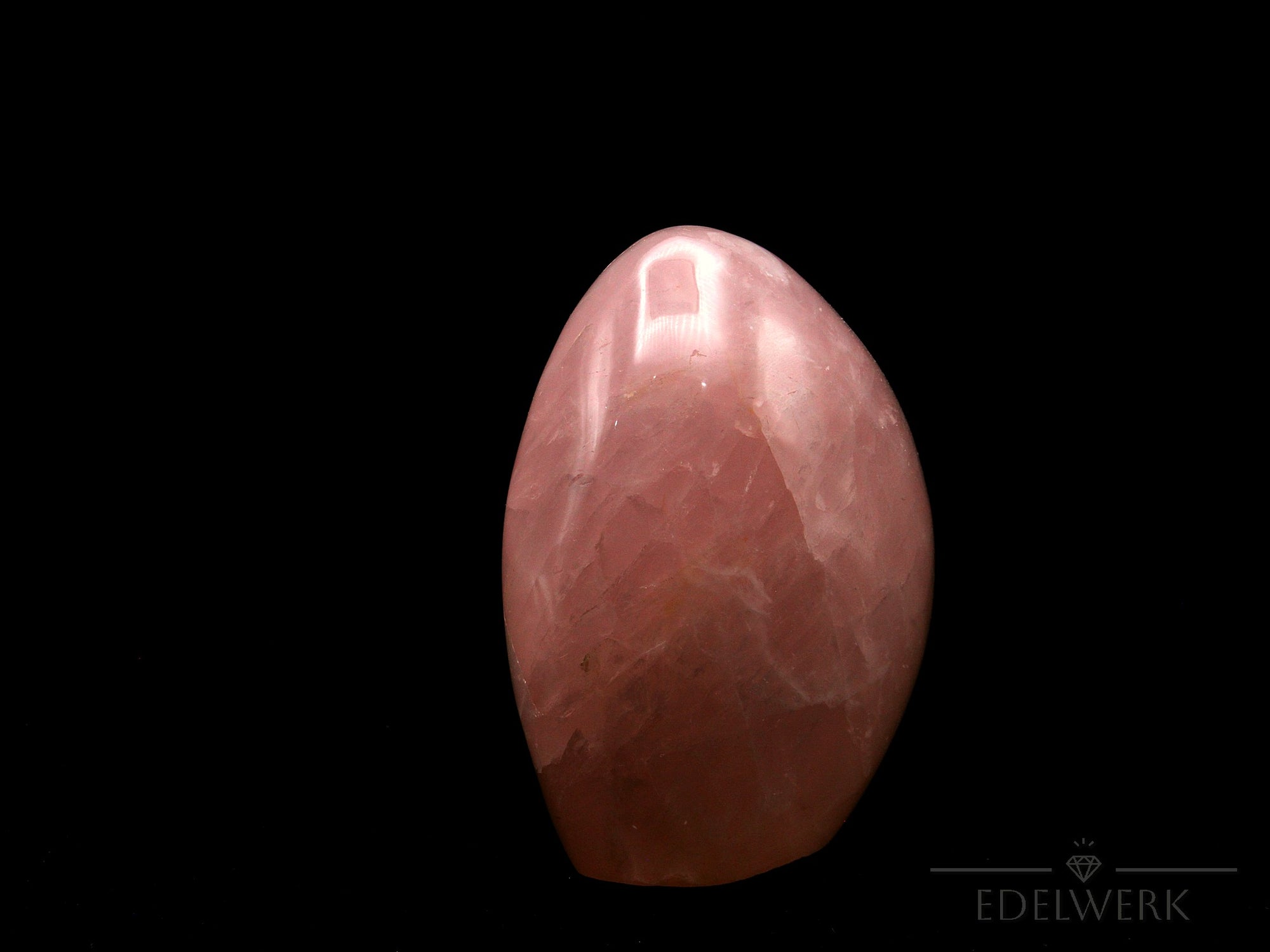 Klarer Rosenquarz, Heilstein für intuitive Balance, durchsichtige rosa Struktur.