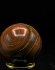 Tigeraugen Kugel Planet, fördert energetische Harmonie, gold-braune Kugelstruktur.