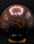 Tigeraugen Kugel Planet, fördert Selbstbewusstsein, gold-braune Kugelstruktur.