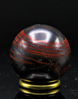 Tigeraugen Kugel Planet, Heilstein für entspannende Harmonie, gold-braune Kristallform.
