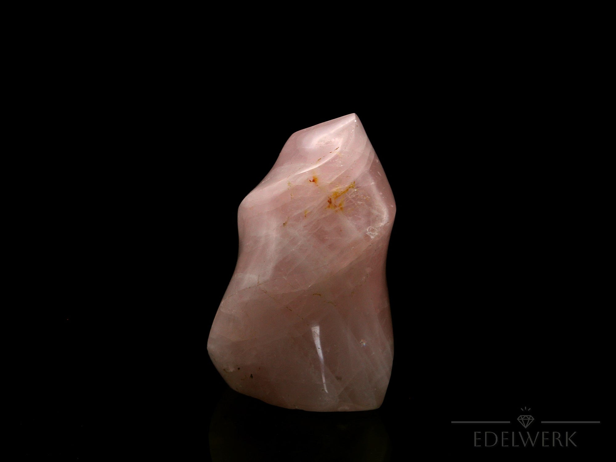 Klarer Rosenquarz, Heilstein für spirituelle Klarheit, rosa Kristalloberfläche.