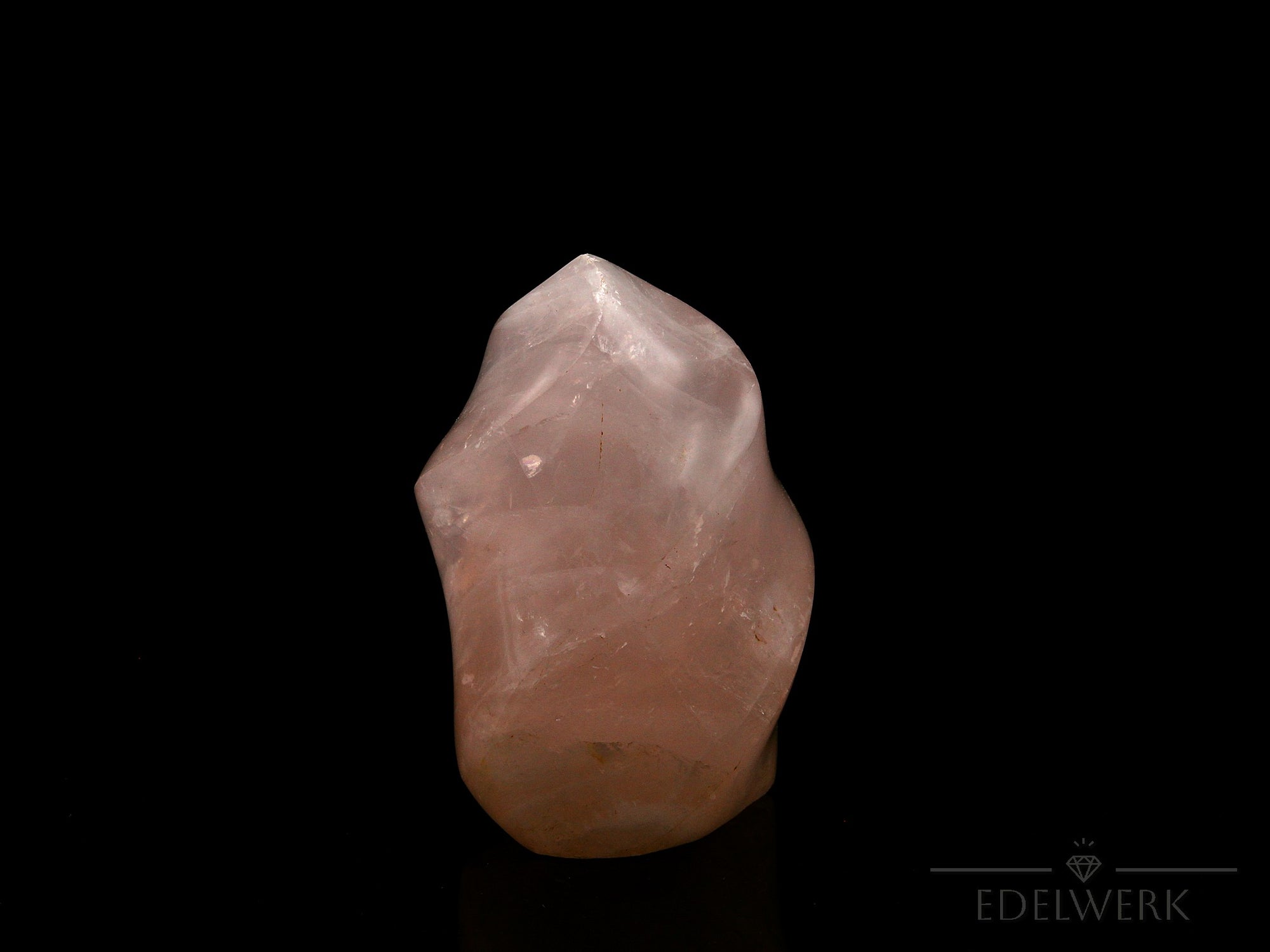Rosenquarz Heilstein, fördert spirituelle Meditation, rosa Kristallstruktur.