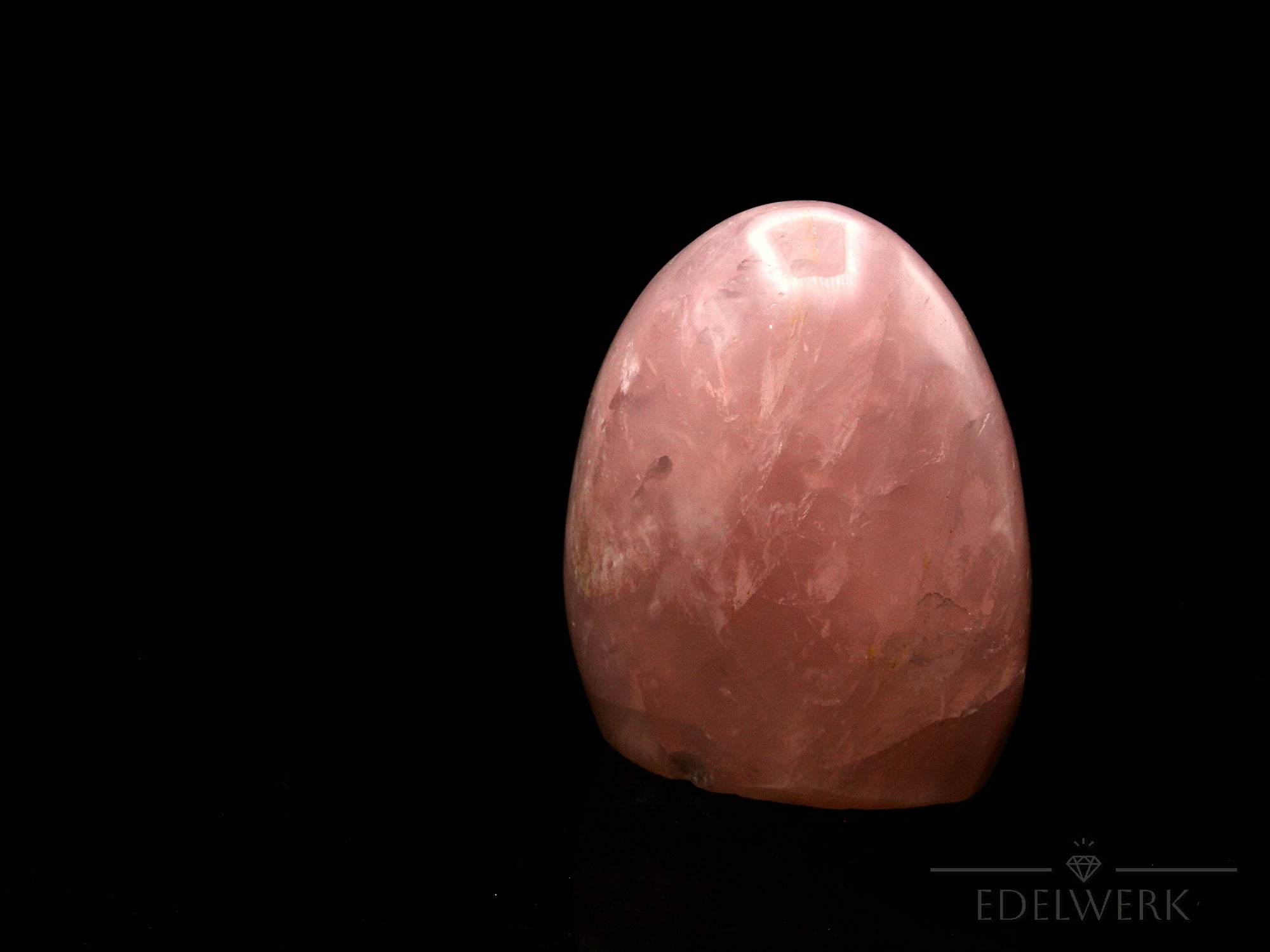 Klarer Rosenquarz, Heilstein für klare Energie, rosa Kristallform.
