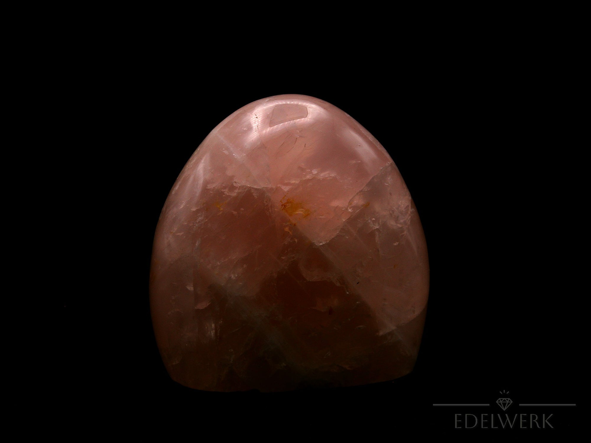 Strahlender Rosenquarz, Heilstein für innere Stärke, rosa Oberfläche.
