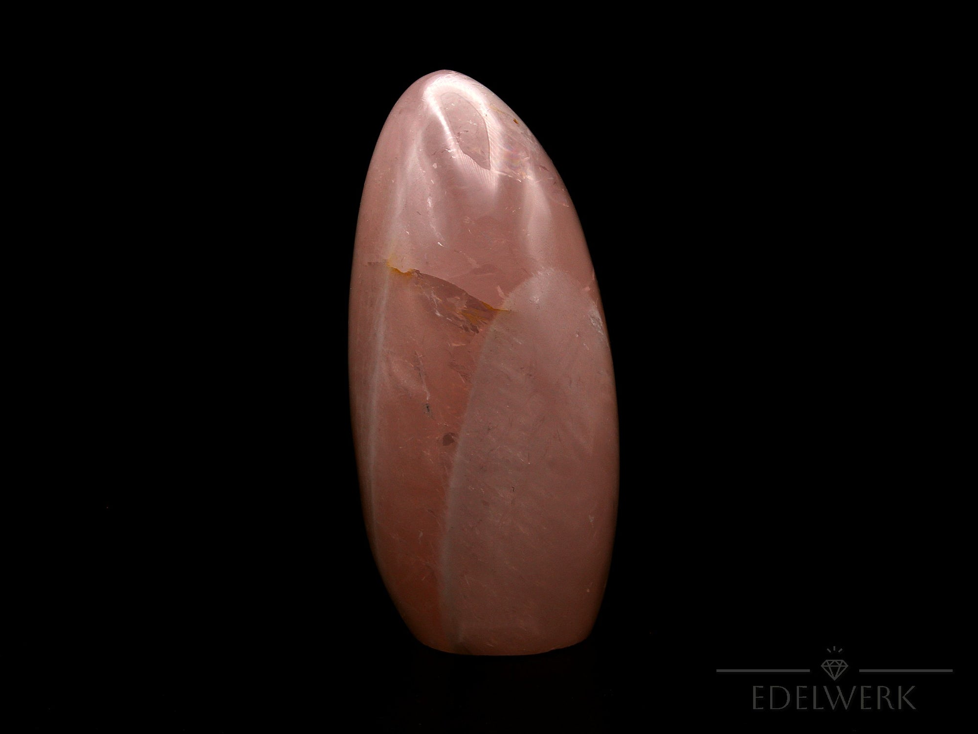 Natürlicher Rosenquarz, fördert spirituelle Harmonie, rosa Oberfläche.
