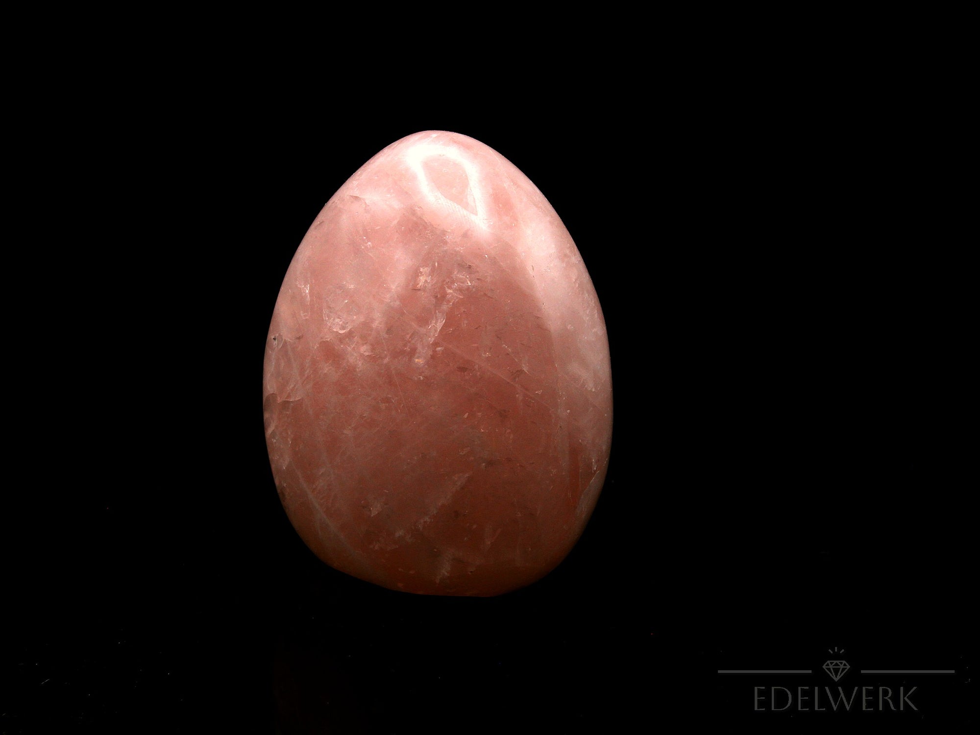 Rosenquarz Heilstein, fördert energetische Kraft, rosa Kristallstruktur.