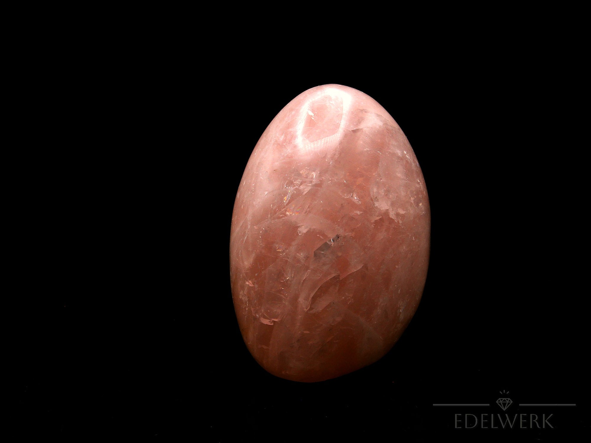 Rosenquarz Heilstein, fördert meditative Energie, rosa natürliche Struktur.