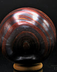 Tigeraugen Kugel Planet, fördert schützende Energie, gold-braune Kugelstruktur.