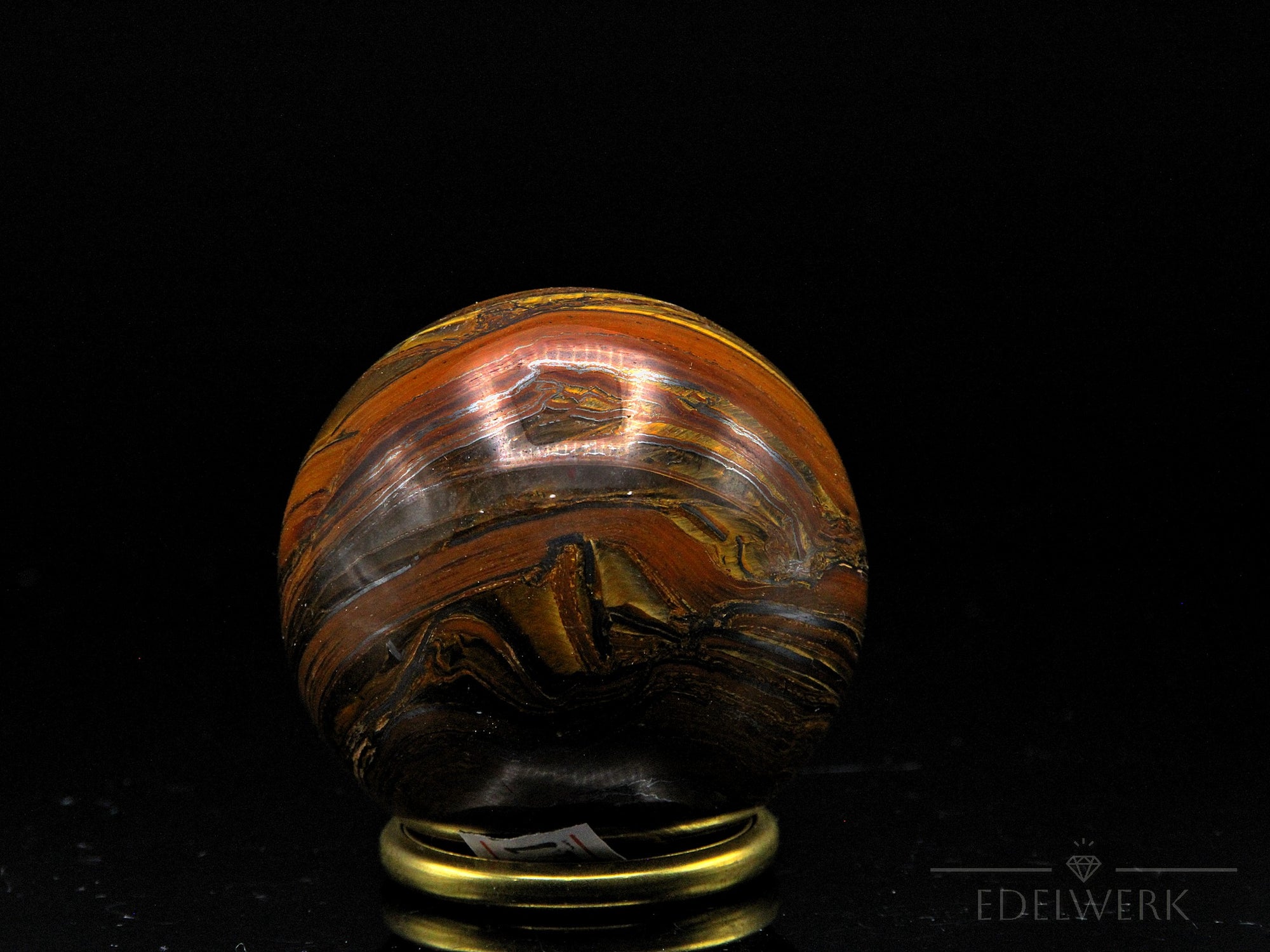 Tigeraugen Kugel Planet, Heilstein für ausgewogene Energie, glänzende gold-braune Form.